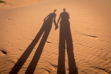 Couple shadow at Sand Duneの写真素材