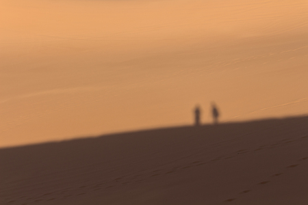Couple shadow on Sand Duneの写真素材