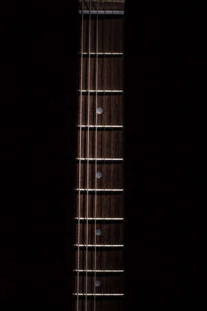 guitar neck illuminated from the top