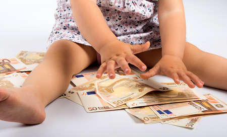 Many money in little handsの写真素材