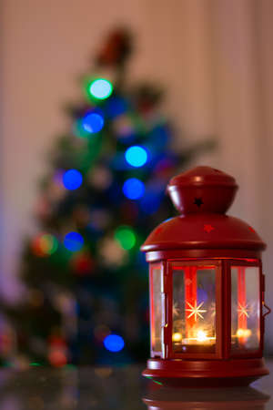 candle and colored Christmas lightsの写真素材