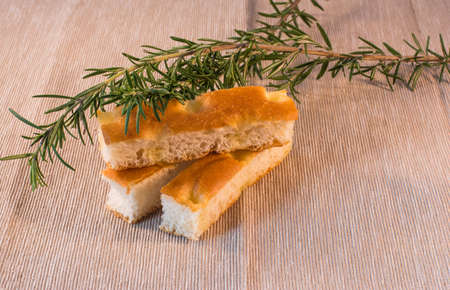 three strips of focaccia with rosemary sprigsの写真素材