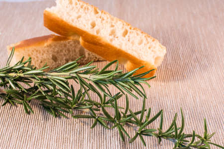 two strips of focaccia with rosemary sprigsの写真素材