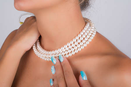 pearl necklace on neck of young modelの写真素材