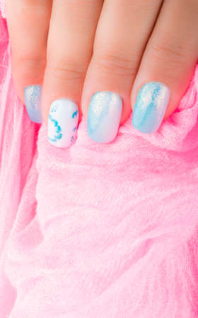Nail art and pink scarfの写真素材
