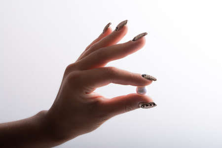 Nail art and big pearlsの写真素材