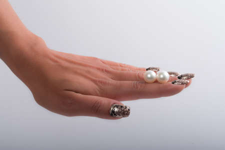 Nail art and big pearlsの写真素材