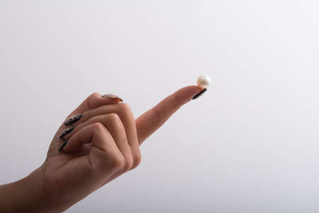 Nail art and big pearlsの写真素材