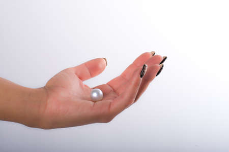 Nail art and big pearlsの写真素材