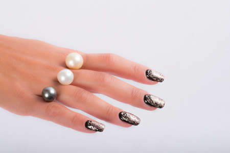 Nail art and big pearlsの写真素材