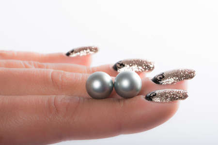 Nail art and big pearlsの写真素材