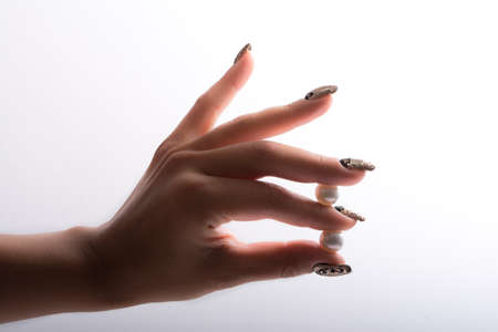 Nail art and big pearlsの写真素材