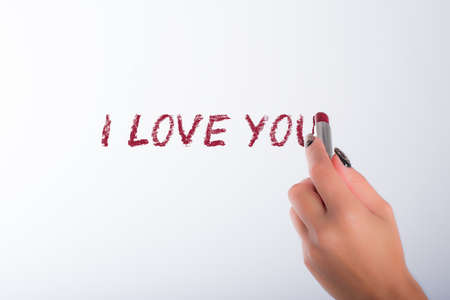 nails decorated with neutral colors and lipstickの写真素材