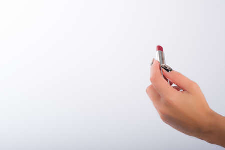 nails decorated with neutral colors and lipstickの写真素材