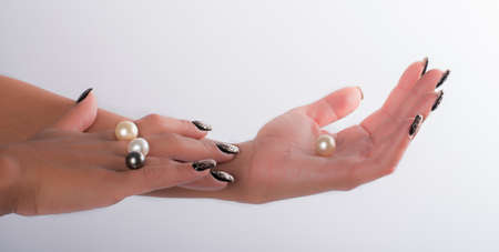 Nail art and big pearlsの写真素材