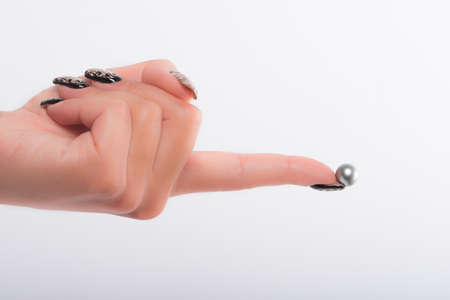 Nail art and big pearlsの写真素材