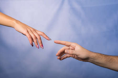 male and female hands approaching