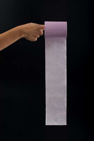 woman's hand and roll purpleの写真素材