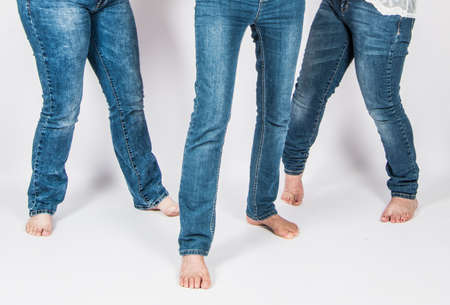 girls legs with blue jeansの写真素材