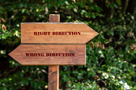 wooden sign indicating right or wrong directionの写真素材
