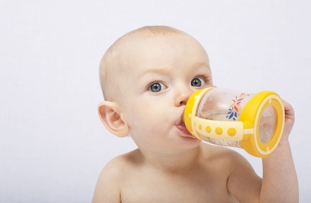 baby with her baby bottle
