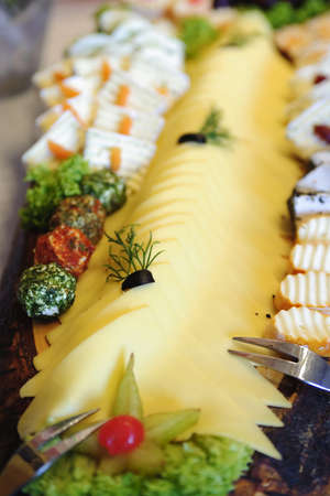 Variety of assorted cheeses served in a restaurant