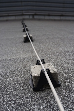 Lightning conductor rod mounted on blacks and used to divert the electrical current from a lightning strike away from a structureの写真素材