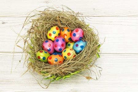 Nest full of colorful Easter Eggsの写真素材