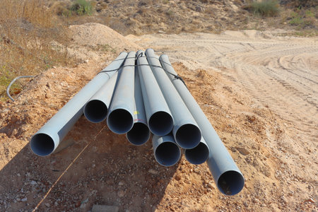 Plastic water pipes in a construction site, closeup of photo
