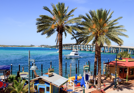 Gulf Shore ocean inlet with boats, restaurants, shopping for tourist.の写真素材