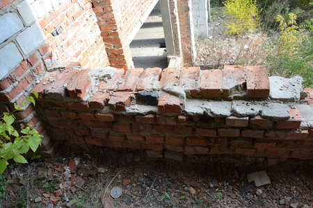 Texture of an old brick wall with plaster