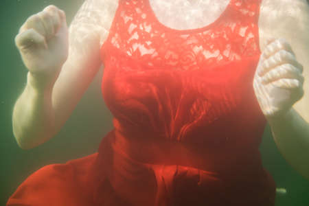 Breast of vintage dress Women with a red vintage dress swimmingの写真素材