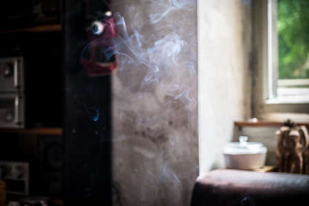 Smoke with sunlight from behind a windowの写真素材