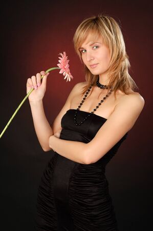 beautiful girl with a flowerの写真素材