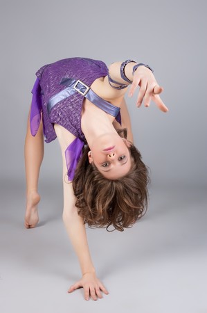 modern style dancer posing. Isolated over gray background.の写真素材