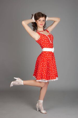 Lady In Red. Gray backgroundの写真素材