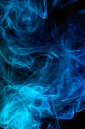 Abstract blue smoke over black backgroundの写真素材