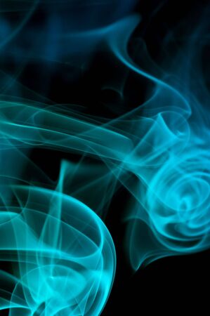 bstract blue smoke over black background
の写真素材
