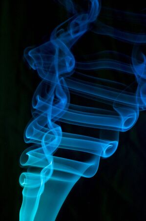 Blue smoke on black. の写真素材