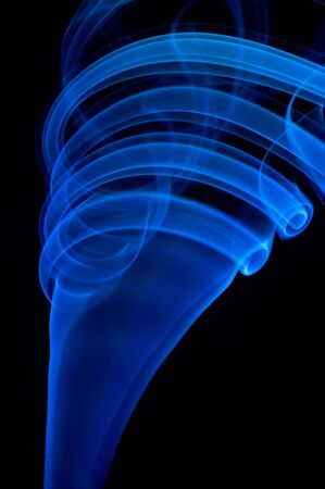 Blue smoke on black.の写真素材