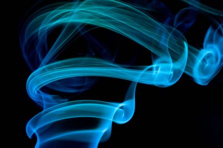 Blue smoke on black.の写真素材