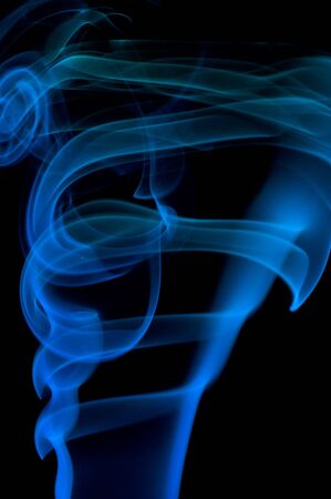 bstract blue smoke over black background
の写真素材
