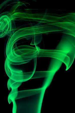 Abstract green smoke over black backgroundの写真素材