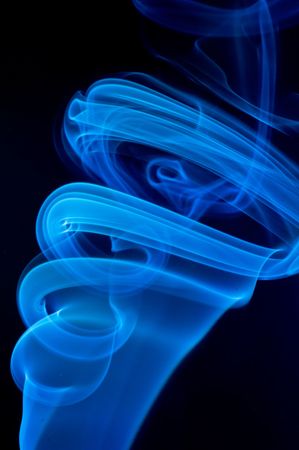 Blue smoke on black.の写真素材