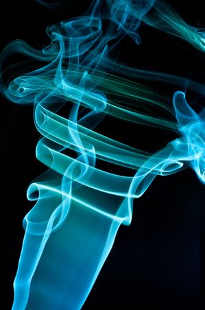 Abstract blue smoke over black background
の写真素材