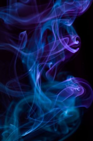 abstract multicolor smoke . black backgroundの写真素材