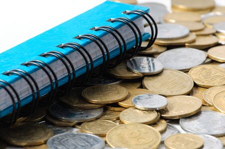 Coins and notebook . close - up .の写真素材