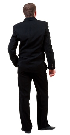 back view of business man in black suit  watching.   Businessman looks ahead.  Isolated over white background. Rear view people collection. backside view of person. の写真素材