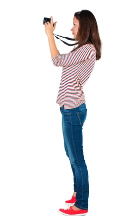 Back view of woman photographing.   girl photographer in jeans. Rear view people collection.  backside view of person.  Isolated over white background.の写真素材