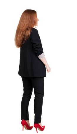 back view of redhead business woman contemplating. Young girl in suit.  Rear view people collection.  backside view of person.  Isolated over white background.の写真素材